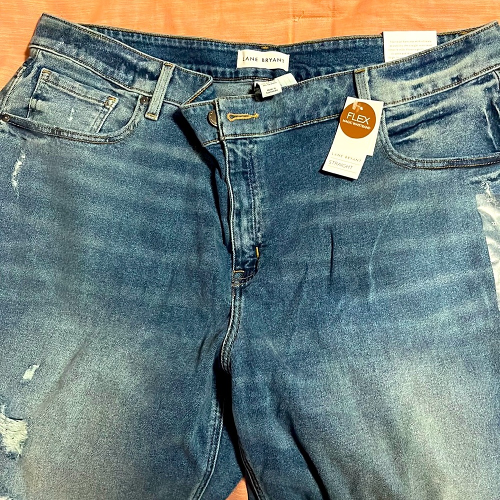Lane Bryant distressed cropped high rise straight fit jeans, medium blue.